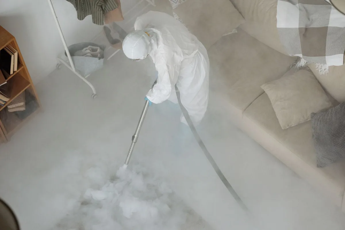 Biohazard cleanup technician in protective equipment, Reedsport, OR